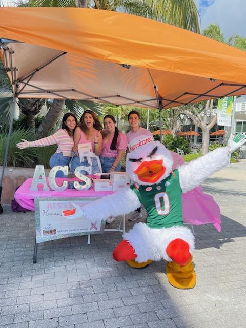 Members of ACS pose with Sebastian the Ibis while fundraising for Breast Cancer Awareness Month.