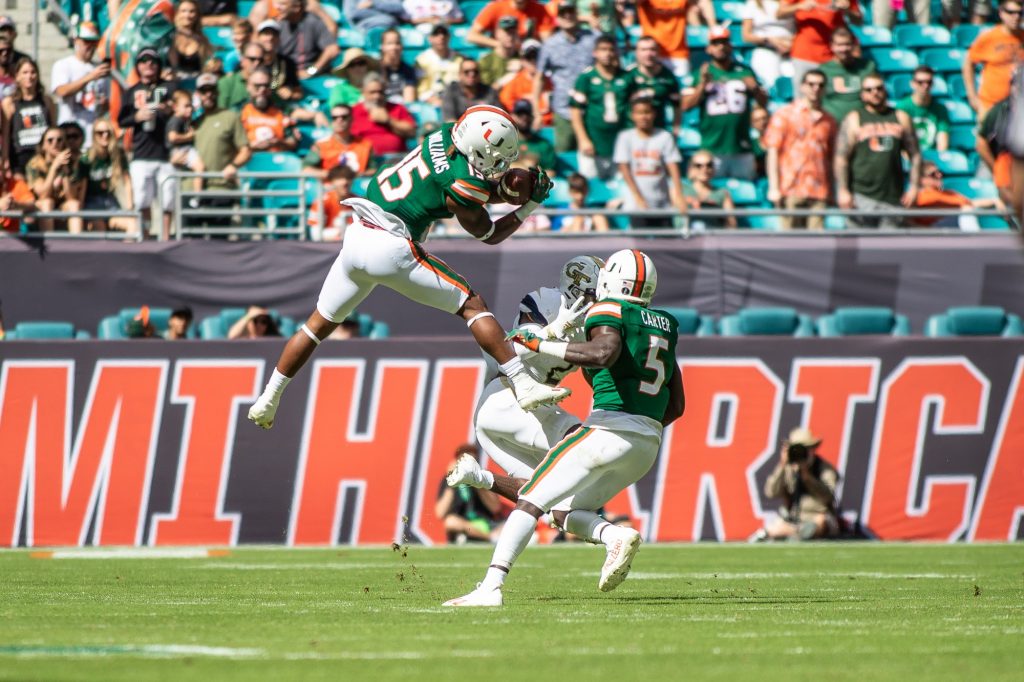 Freshman safety Avantae Williams makes a leaping interception in the first quarter of Miami's 33-30 win over Georgia Tech on Saturday, Nov. 6 at Hard Rock Stadium.