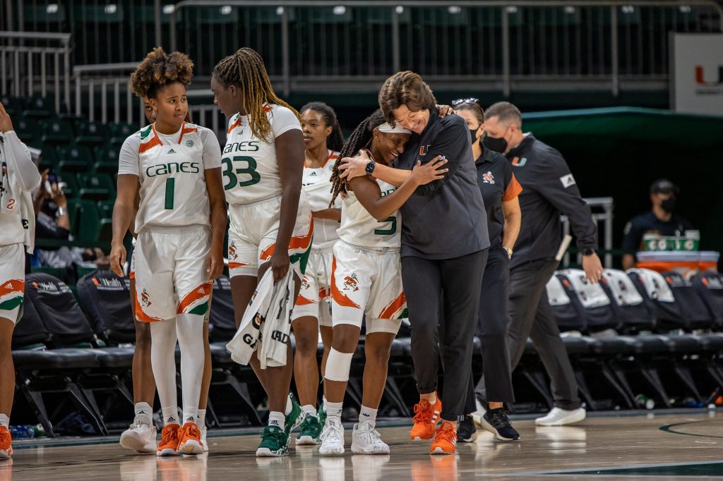 Miami women's basketball head coach Katie Meier hugs senior Mykea Gray after becoming the winningest coach in Miami basketball history with a win over Jackson State on Nov. 9 at the Watsco Center.