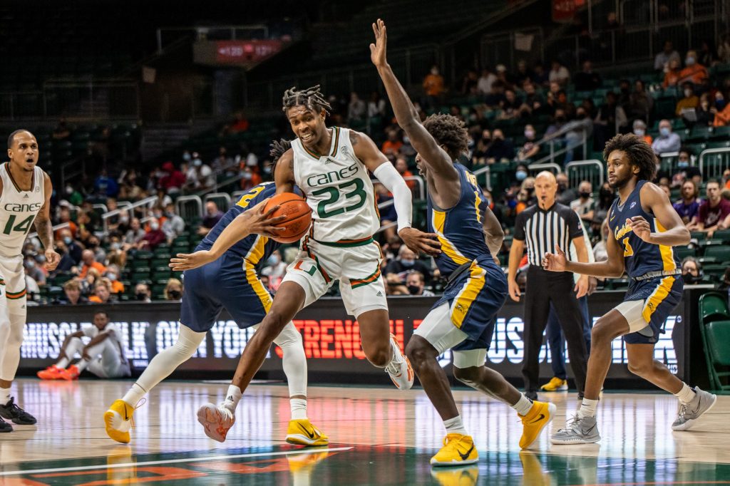 Sixth-year redshirt senior Kameron McGusty evades a Canisius defender to get to the basket in Miami’s 77-67 victory Tuesday night at the Watsco Center. McGusty helped the Canes to victory with a team-high 20 points and 10 rebounds.