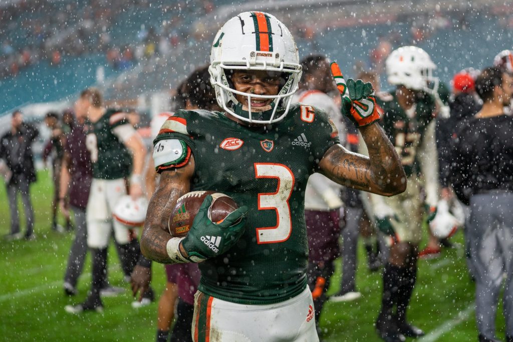 Senior wide receiver Mike Harley celebrates with a game ball after Miami defeated Virginia Tech 38-26 at Hard Rock Stadium on Nov. 20, 2021.