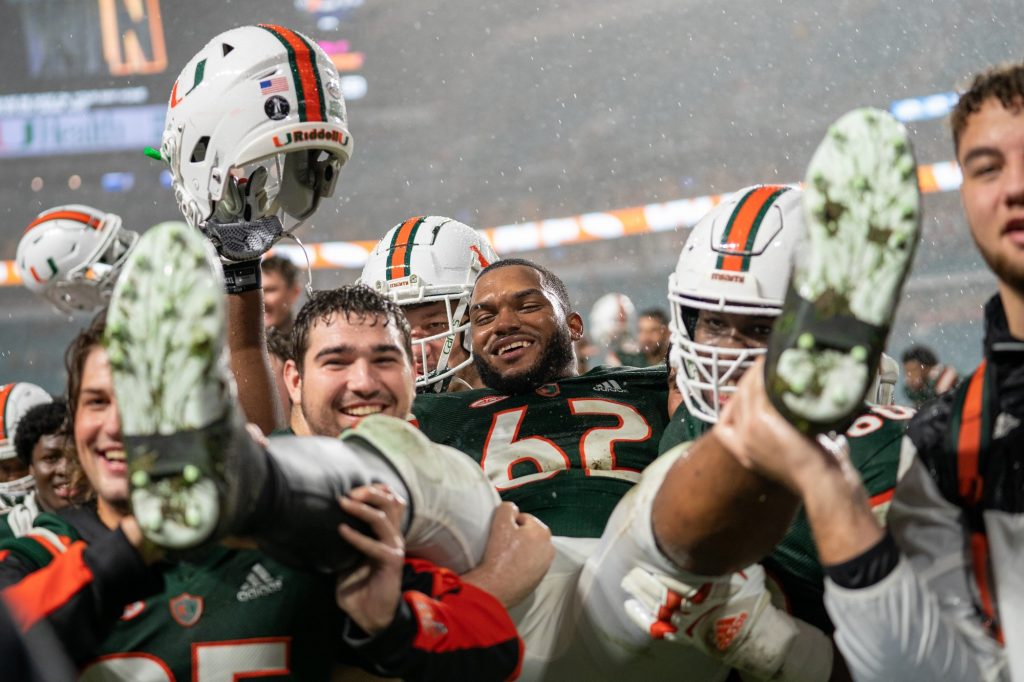 Redshirt Senior offensive lineman Jarrid Williams is carried off of the field by his teammates after the end of Miami’s game versus Virginia Tech at Hard Rock Stadium on Nov. 20, 2021.