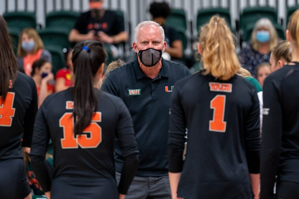 Head coach Jose “Keno” Gandara speaks to his team during a timeout in the second set of Miami’s match versus Boston College in the Knight Sports Complex on Oct. 31, 2021.