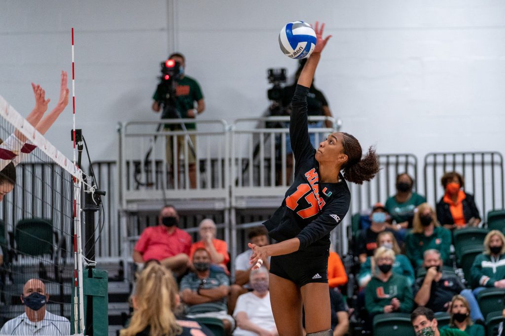Junior middle blocker Janice Leao spikes the ball during the third set of Miami’s match versus Boston College in the Knight Sports Complex on Oct. 31, 2021.