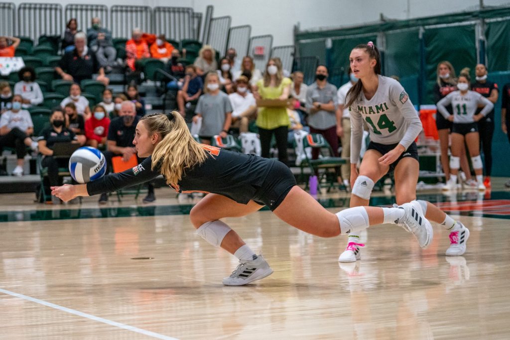 Senior libero Priscilla Hernandez lunges to bump the ball during the first set of Miami’s match versus Syracuse in the Knight Sports Complex on Oct. 29, 2021.