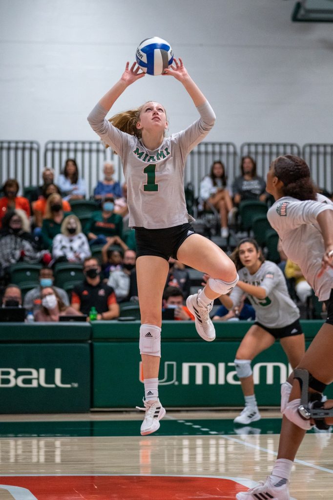 Junior setter Savannah Vach sets the ball for junior middle blocker Janice Leao during the fourth set of Miami’s match versus Syracuse in the Knight Sports Complex on Oct. 29, 2021.