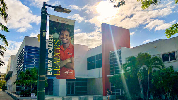 A sign advertising the University of Miami Ever Brighter fundraising campaign. The campaign, which began in 2015 and will conclude in 2025, has raised over $1.6 billion to support further academic, research and facility enhancements within the university.