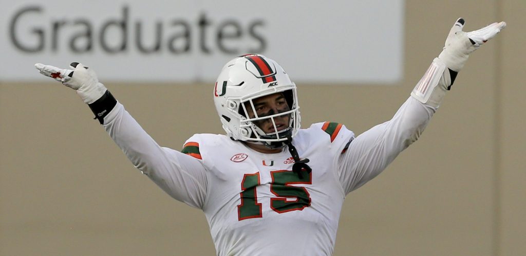 Jaelan Phillips celebrates a defensive stop during the second half of the University of Miami - Virginia Tech NCAA college football game on Saturday, Nov.14 2020, in Blacksburg, Va.