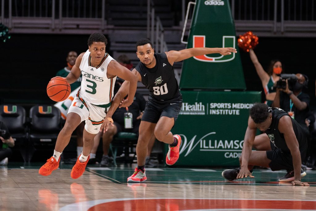 Senior guard Charlie Moore brings the ball downcourt during the first half of Miami’s game versus Stetson University in the Watsco Center on Dec. 20, 2021.