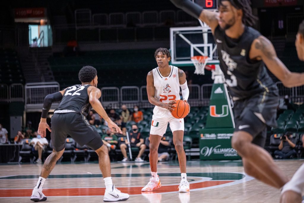 Kameron McGusty handles the ball at the top of the key during Miami's game against UCF on Saturday, ... at the Watsco Center.