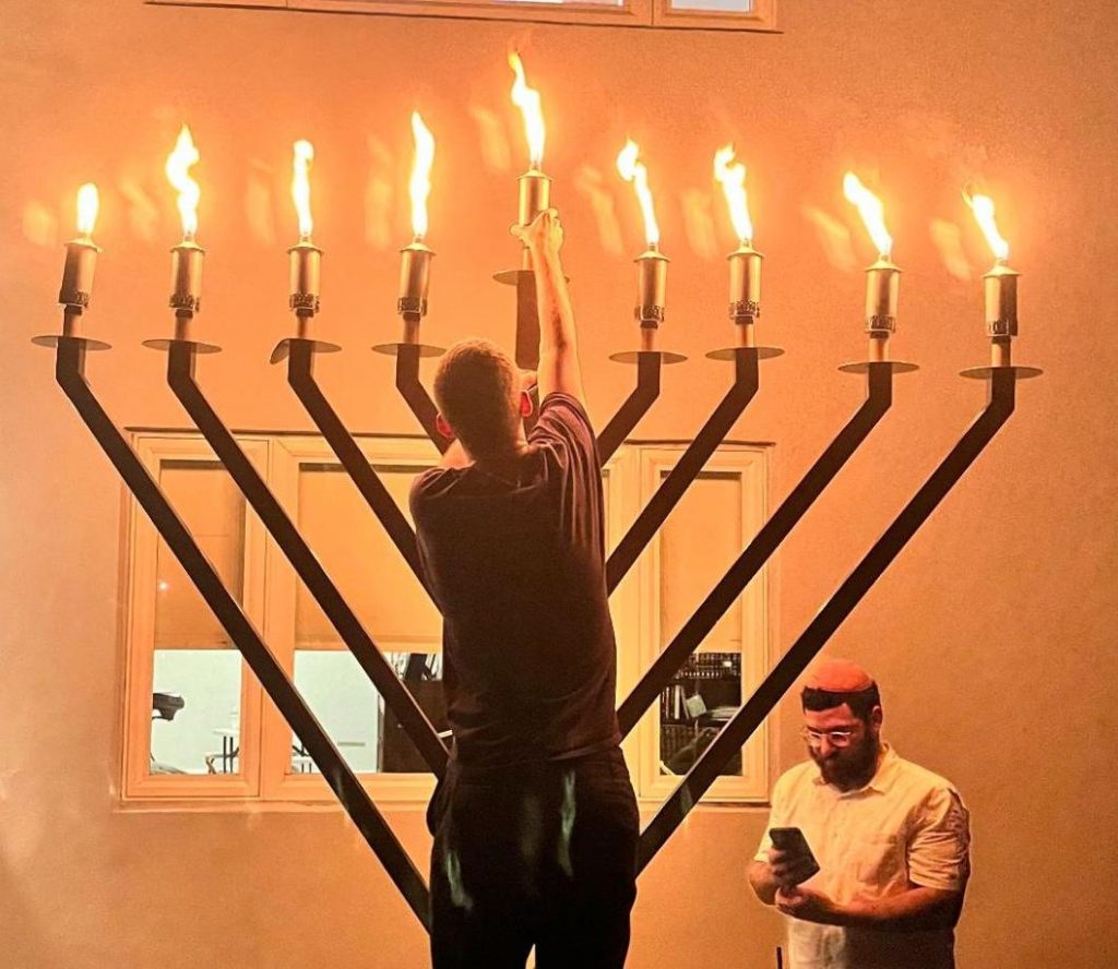 A giant menorah is lit in front of the Chabad House on Dec. 5. This year marked the first time Hanukkah has overlapped with the fall semester in two years.