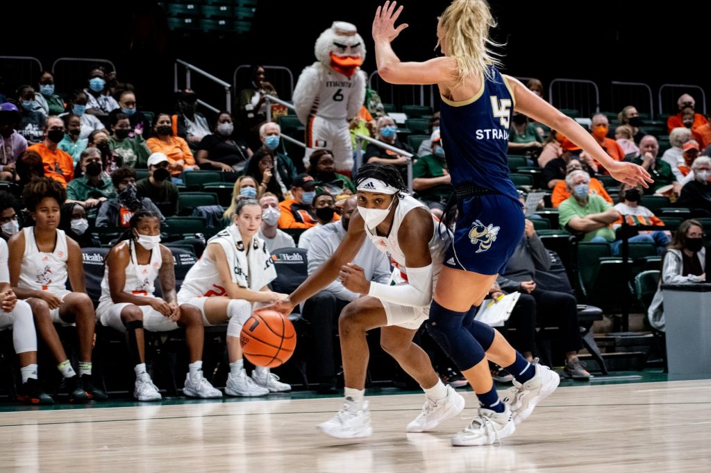 Freshman Lashae Dwyer fights past a Georgia Tech defender during the second half of Miami’s victory on Sunday, Jan. 16 at the Watsco Center.