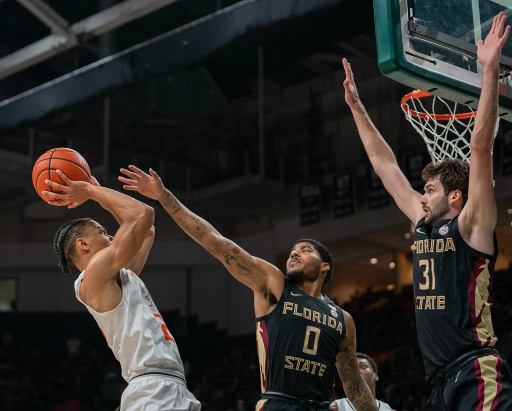 Third-year sophomore guard Isaiah Wong shoots a fadeaway during the first half of Miami’s game versus Florida State in the Watsco Center on Jan. 22, 2022.