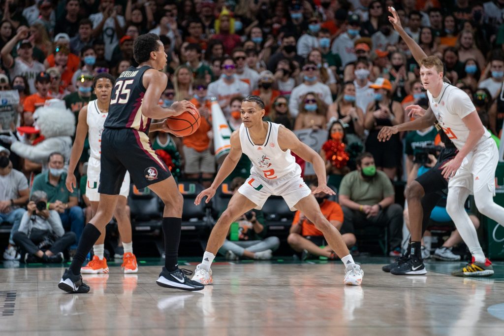 Third-year sophomore guard Isaiah Wong guards a Seminole during the first half of Miami’s game versus Florida State in the Watsco Center on Jan. 22, 2022.
