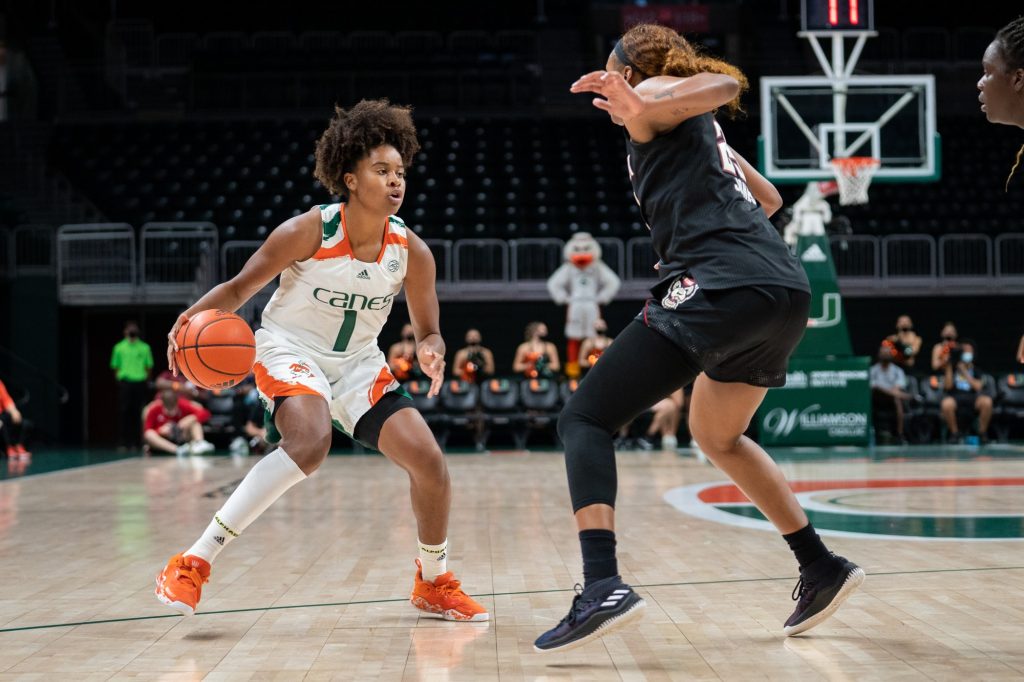 Junior guard/forward Moulayna Johnson Sidi Baba attempts to lose a defender during the first quarter of Miami’s game versus NC State in the Watsco Center on Jan. 9, 2022.