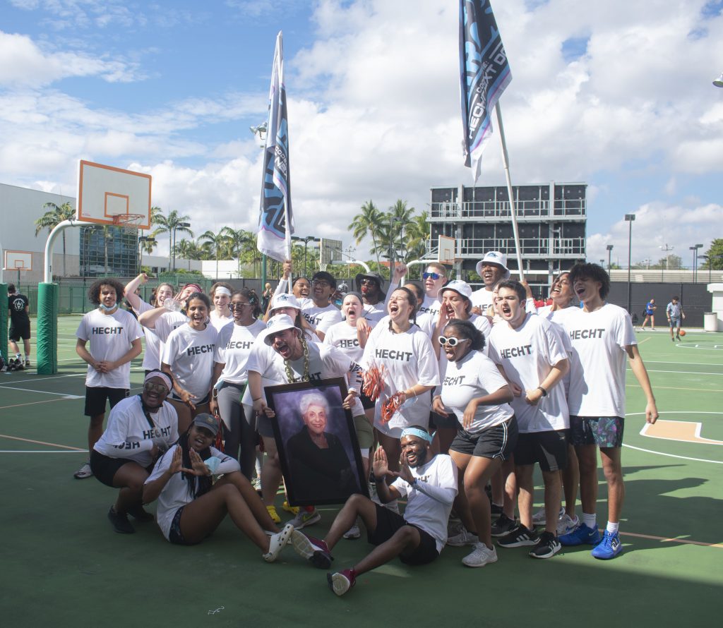 Hecht residents celebrate their win on the basketball courts following the SportFest basketball tournament.