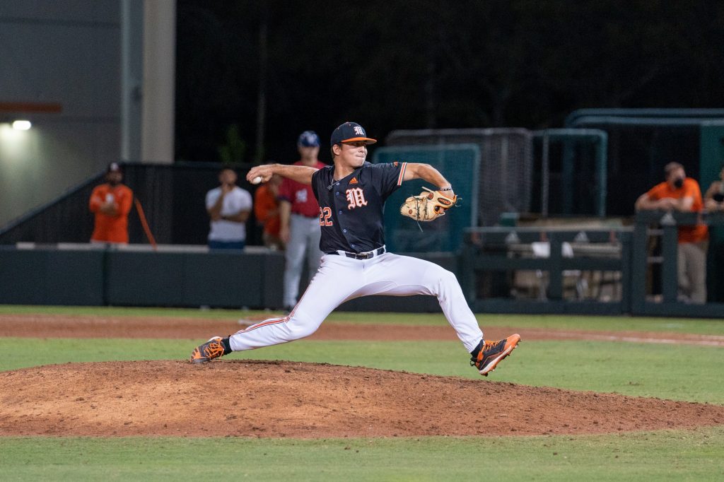 Junior pitcher Anthony Arguelles pitches in the top of the ninth inning of Miami’s game versus FAU at Mark Light Field on Feb. 23, 2022.