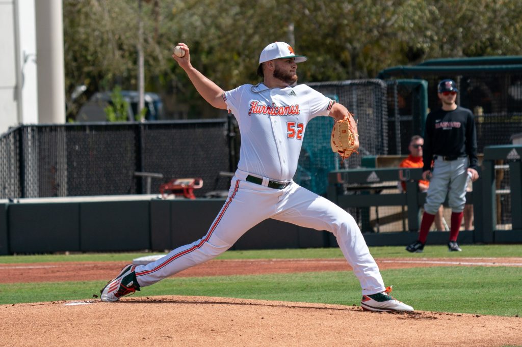 Sophomore pitcher Jake Garland pitches at the top of the first inning of Miami’s game versus Harvard at Mark Light Field on Feb. 27, 2021.