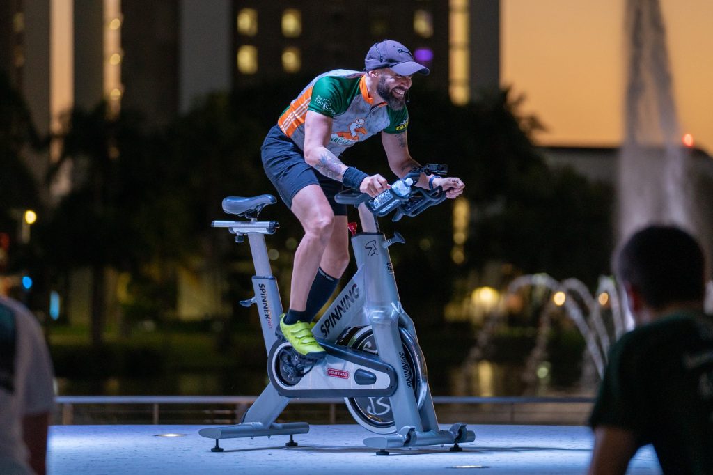 Instructor Guido Milian leads a class during the Team Hurricanes Dolphins Challenge Cancer Cycle Sesh at the Lakeside Patio on Feb. 24, 2022.