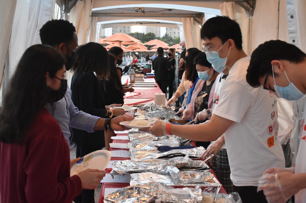 Students get food at the beginning of the Lunar New Year Festival on the Lakeside Patio on Feb. 7, 2022.