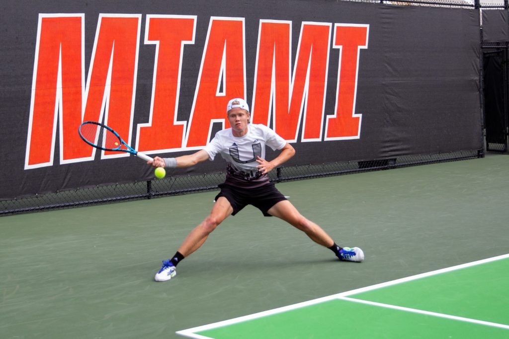 Freshman Matin Katz reaches for the ball during his singles match against FAU at the Neil Schiff Tennis Center on Feb. 25.