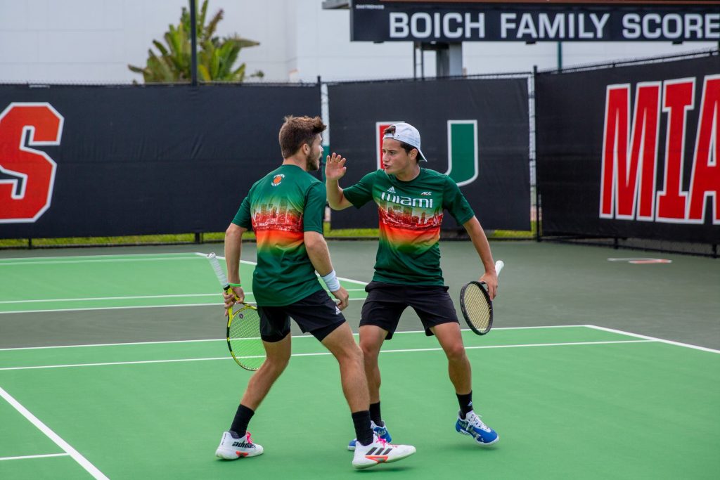 Fourth-year junior Oren Vasser and freshman Matin Katz celebrate their doubles win against FAU at the Neil Schiff Tennis Center on Feb. 25