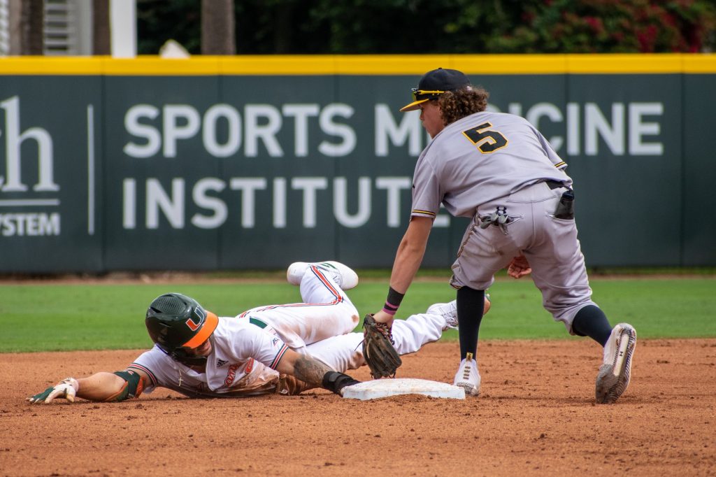 Sophomore CJ Kayfus steals second base during Miami's fourth game against Towson on Sunday, February 20, 2022 at Mark Light Field.