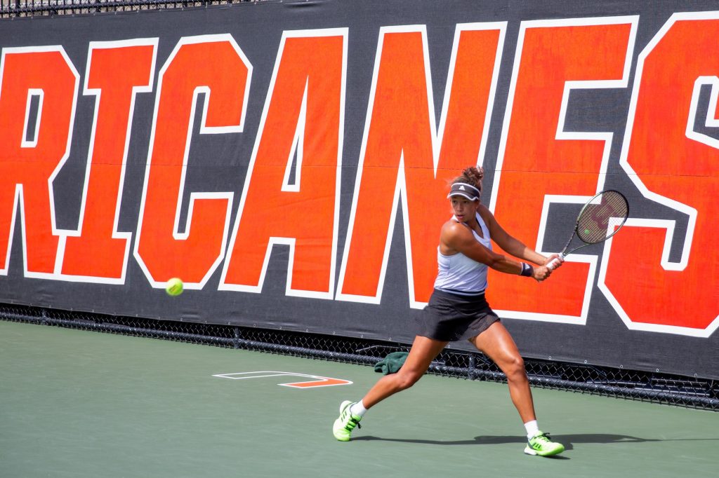 Fourth-year junior Daevenia Achong prepares to hit a ball during her doubles match on Sunday, Feb. 20 at the Schiff Tennis Center. Achong won both her doubles and singles matches on Sunday in Miami's win over UCF.