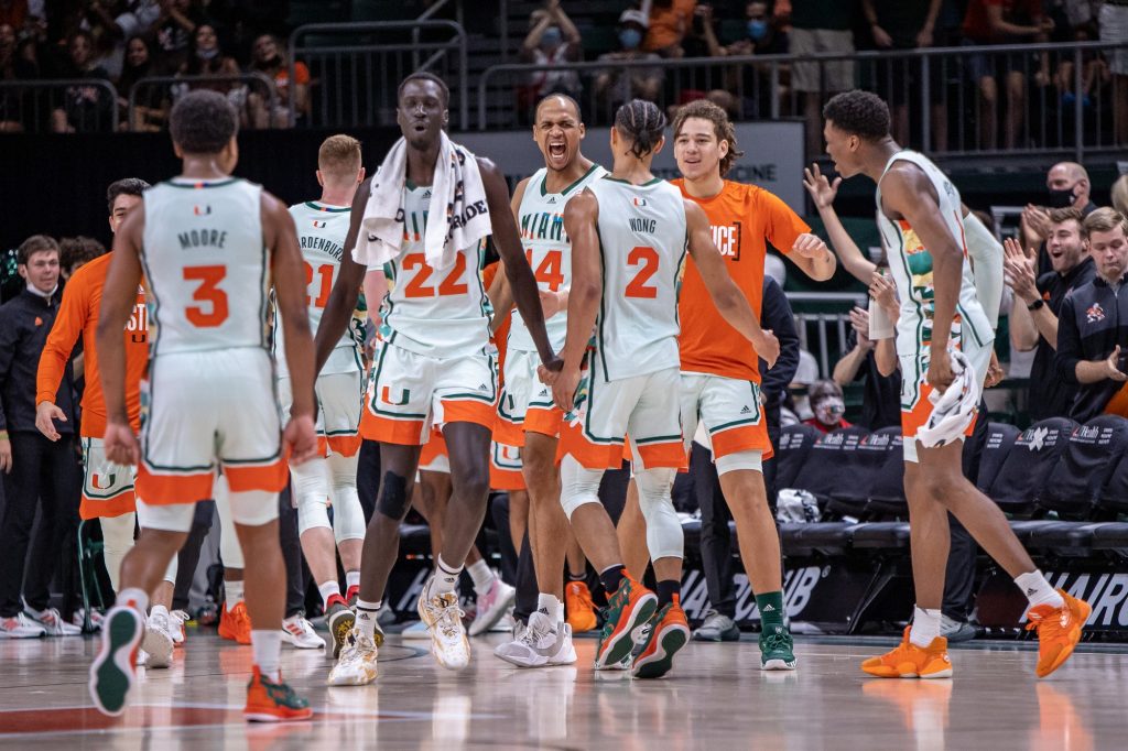 Third-year sophomore Isaiah Wong celebrates with teammates after hitting a buzzer beater the end of the second half against Virginia Tech on Saturday, Feb. 26, 2022 at the Watsco Center.