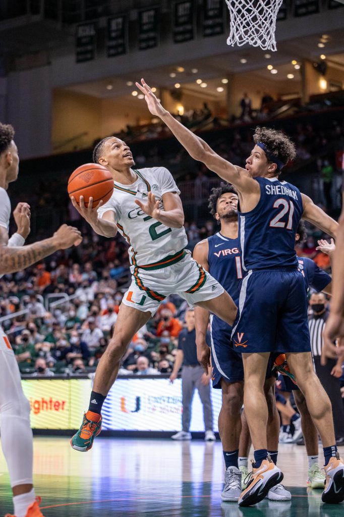 Third-year sophomore Isaiah Wong attempts a shot during the first half of Miami's loss to Virginia on Saturday, Feb. 19 at the Watsco Center. Miami led Virginia 38-30 at the end of the first half but could not hold on giving up 44 points in the second half.