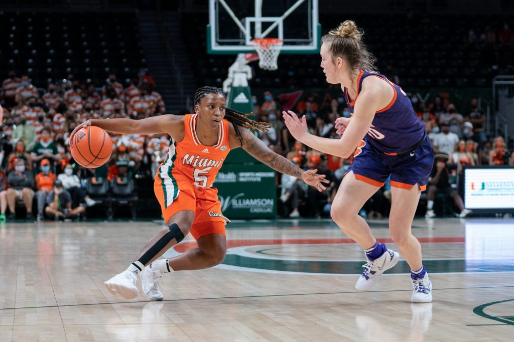 Senior guard Mykea Gray crosses over and shakes a Clemson defender during the second quarter of Miami’s game versus Clemson in The Watsco Center on Feb. 27, 2022.