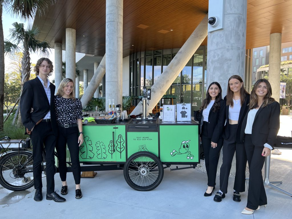 Student workers are seen at the grand opening of the second Brewbike on campus.