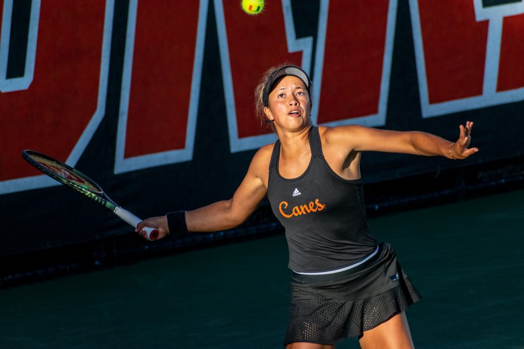 Fourth-year junior Daevenia Achong rallies the ball during Miami's double match against Georgia Tech on Friday, February 25, 2022 at the Neil Schiff Tennis Center.