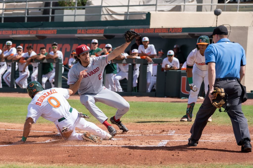 Freshman infielder Dorian Gonzalez Jr. steals home on a wild pitch in the bottom of the first inning to give Miami an early 1-0 lead in their win over Harvard at Mark Light Field on Feb. 27, 2022.