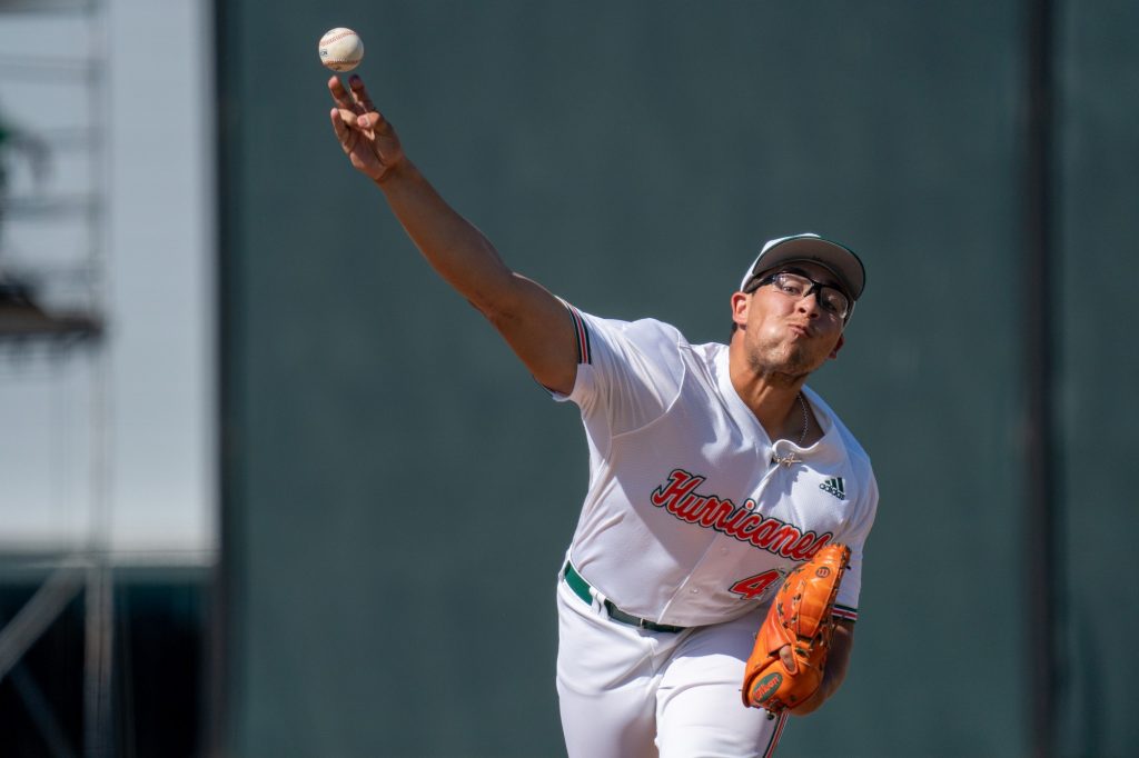 Sophomore pitcher Alejandro Torres pitches at the top of the eleventh inning of Miami’s game versus the University of North Carolina at Chapel Hill at Mark Light Field on March 27, 2022.