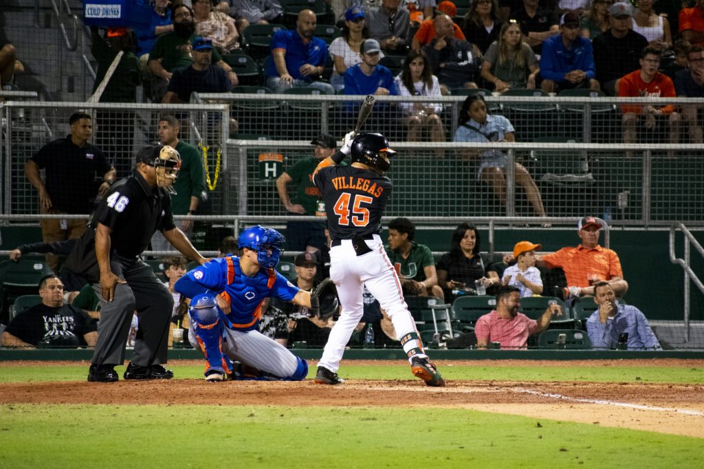Freshman outfielder Edgardo Villegas bats during Miami’s game versus Florida at Mark Light Field on March. 5, 2022.
