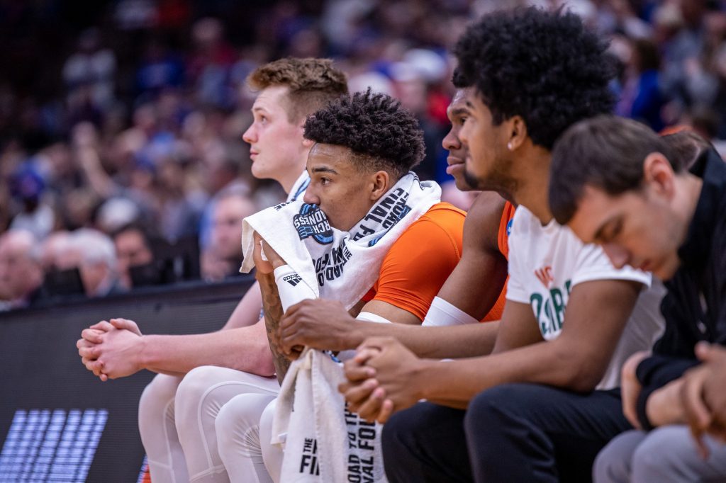 Miami's veteran players look on from the bench in the Hurricanes' 76-50 loss to top-seeded Kansas on Sunday, March 27, 2022 at the United Center in Chicago.