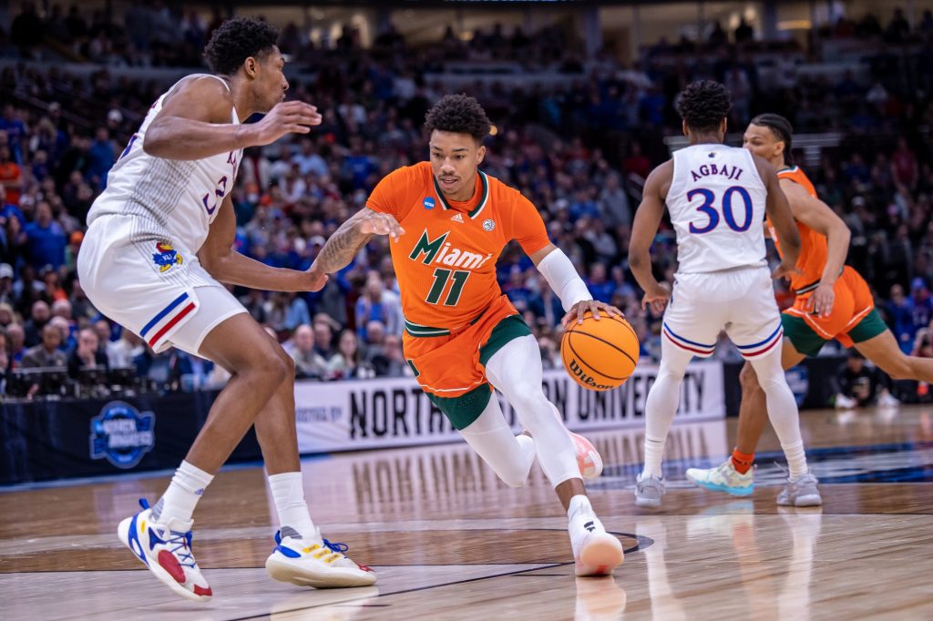 Junior guard Jordan Miller dribbles into the paint in Miami's 76-50 loss to top-seeded Kansas in the Elite Eight on Sunday, March 27, 2022 at the United Center in Chicago.