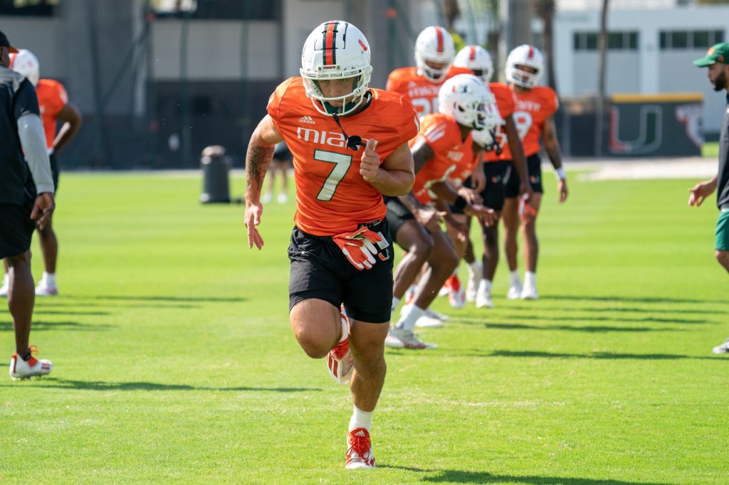 Third-year sophomore wide receiver Xavier Restrepo runs towards the end zone during warmup exercises at the Greentree Practice Fields on March 11, 2022.