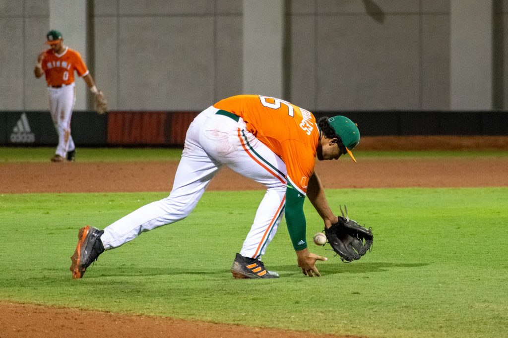 Sophomore infielder Yohandy Morales catches a ball during the eighth inning of Miami's 2-1 win over Harvard on Saturday, Feb. 26, 2022 at Mark Light Field.