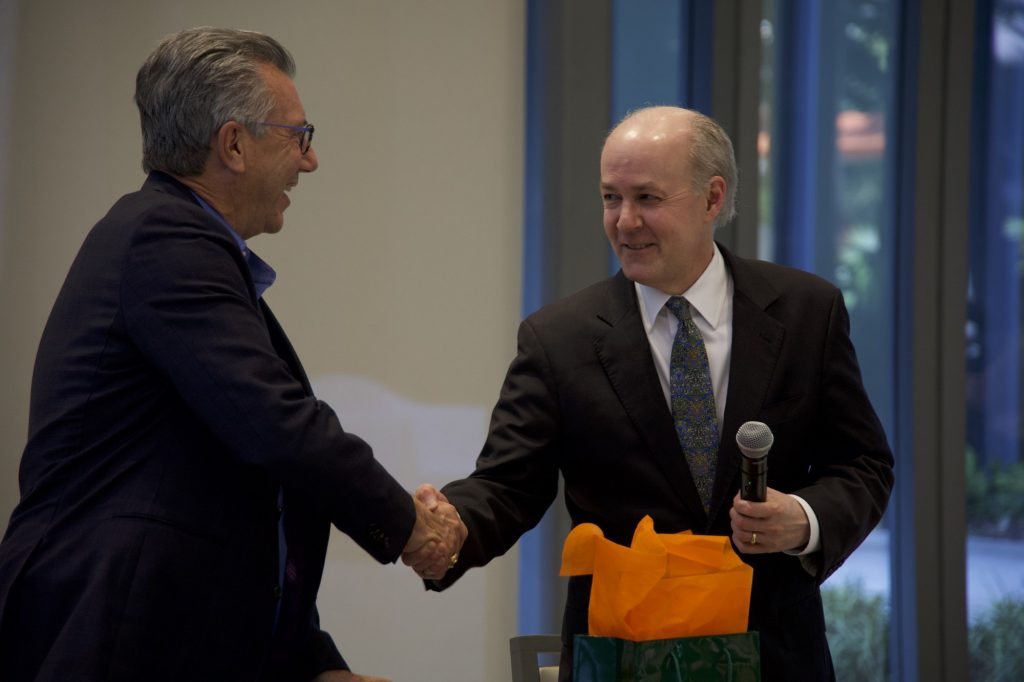 Executive Vice Dean for Academic Affairs and Provost Jeffrey Duerk thanks McKeon with a gift at the end of Tuesday's roundtable discussion. McKeon informed Duerk that he may not be able to accept the gift due to regulations regarding the payment of public officials.