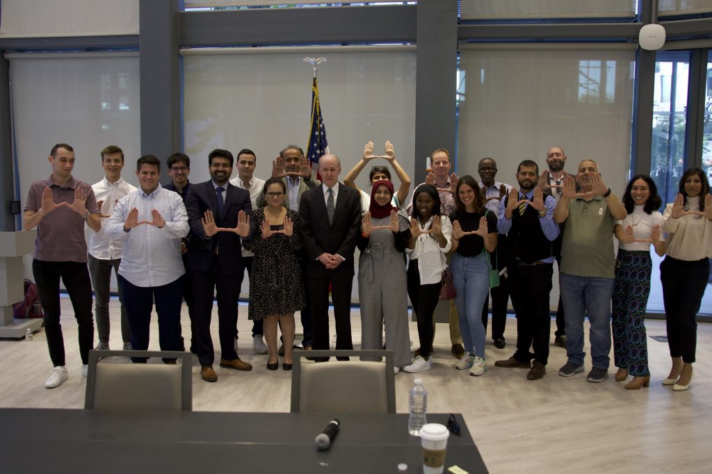 The full panel of Fulbright and Bridge USA scholars throw up the U with McKeon after the conclusion of Tuesday's event.