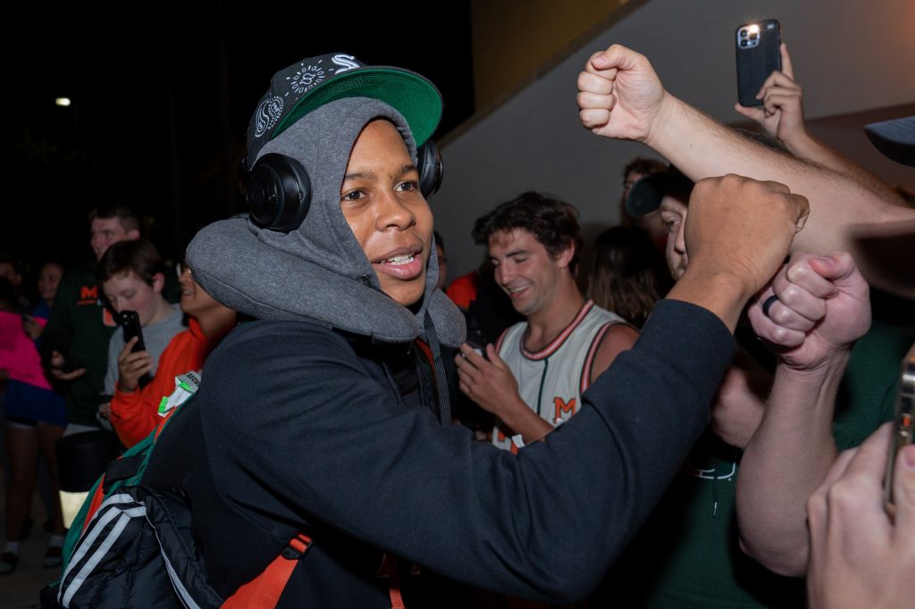 Sixth-year redshirt senior guard Charlie Moore greets fans after arriving back at the Watsco Center on March 27, 2022.