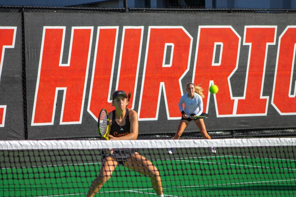Sophomores Isabella Pfennig, and Audrey Boch-Collins playing together as doubles partners at the Miami Spring Invite Event on Jan. 14 at the Neil Schiff Tennis Center.
