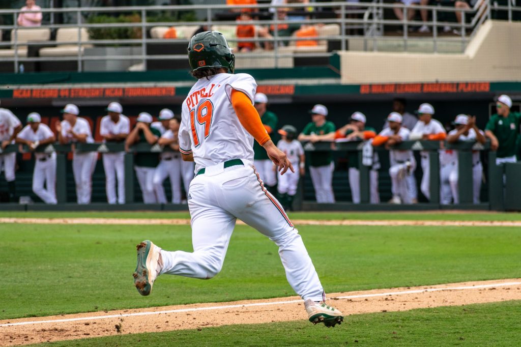 Sophomore infielder Dominic Pitelli scores a run during Miami's 3-11 loss against the Flordia gators on Sunday, March 6, 2022 at Mark Light Field.