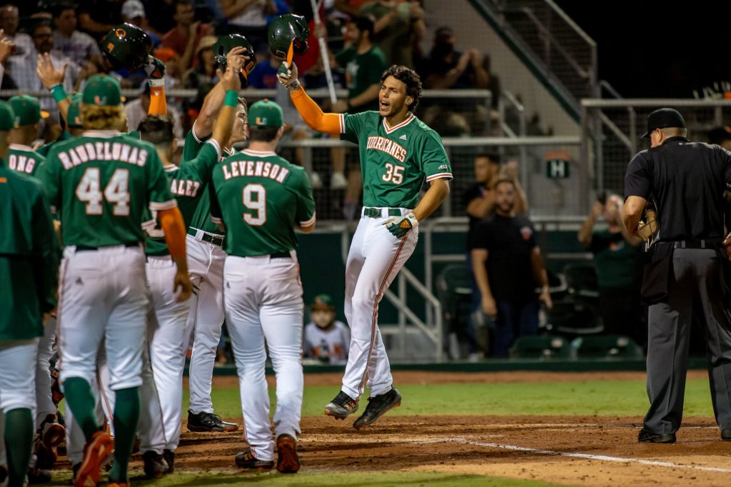 Sophomore third baseman Yohandy Morales celebrates as he crosses home plate after hitting a homerun in Miami's win over Florida on Friday, March 4, 2022 at Mark Light Field.