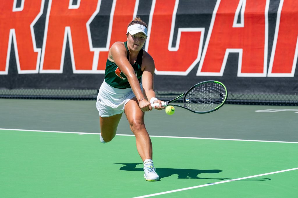 Third-year sophomore Diana Khodan races to return the ball during the sixth game in the first set of her match versus Seminole redshirt senior Kianah Motosono at the Neil Schiff Tennis Center on March 11, 2022.