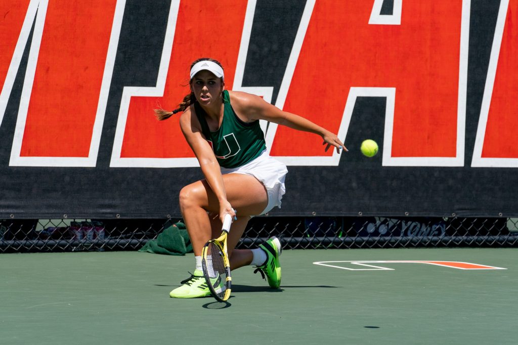 Sophomore Audrey Boch-Collins returns the ball during the sixth game of the first set of her singles match against Seminole sophomore Anna Arkadianou during Miami’s match versus Florida State at the Neil Schiff Tennis Center on March 11, 2022.