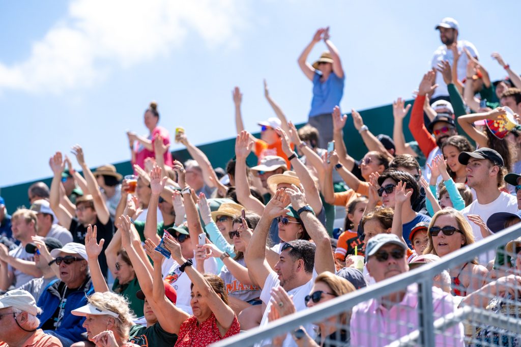 Canes fans cheer in the bottom of the fourth inning of Miami’s game versus the University of Virginia at Mark Light Field on April 10, 2022.