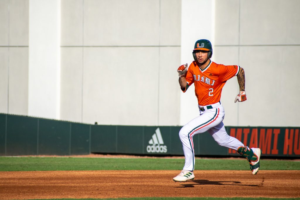 Sophomore CJ Kayfus goes to second base for a single during Miami's game against Bethune-Cookman on Tuesday, April 19, 2022 at Mark Light Field.